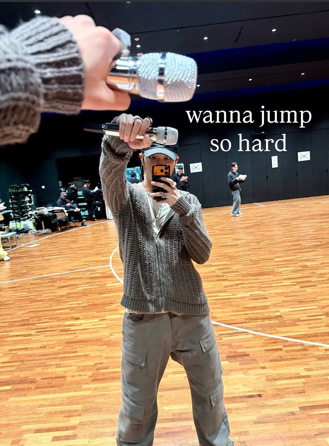 Namjoon in Insta - in the rehearsal room with a mic in his hand. The caption reads 'wanna jump so hard'