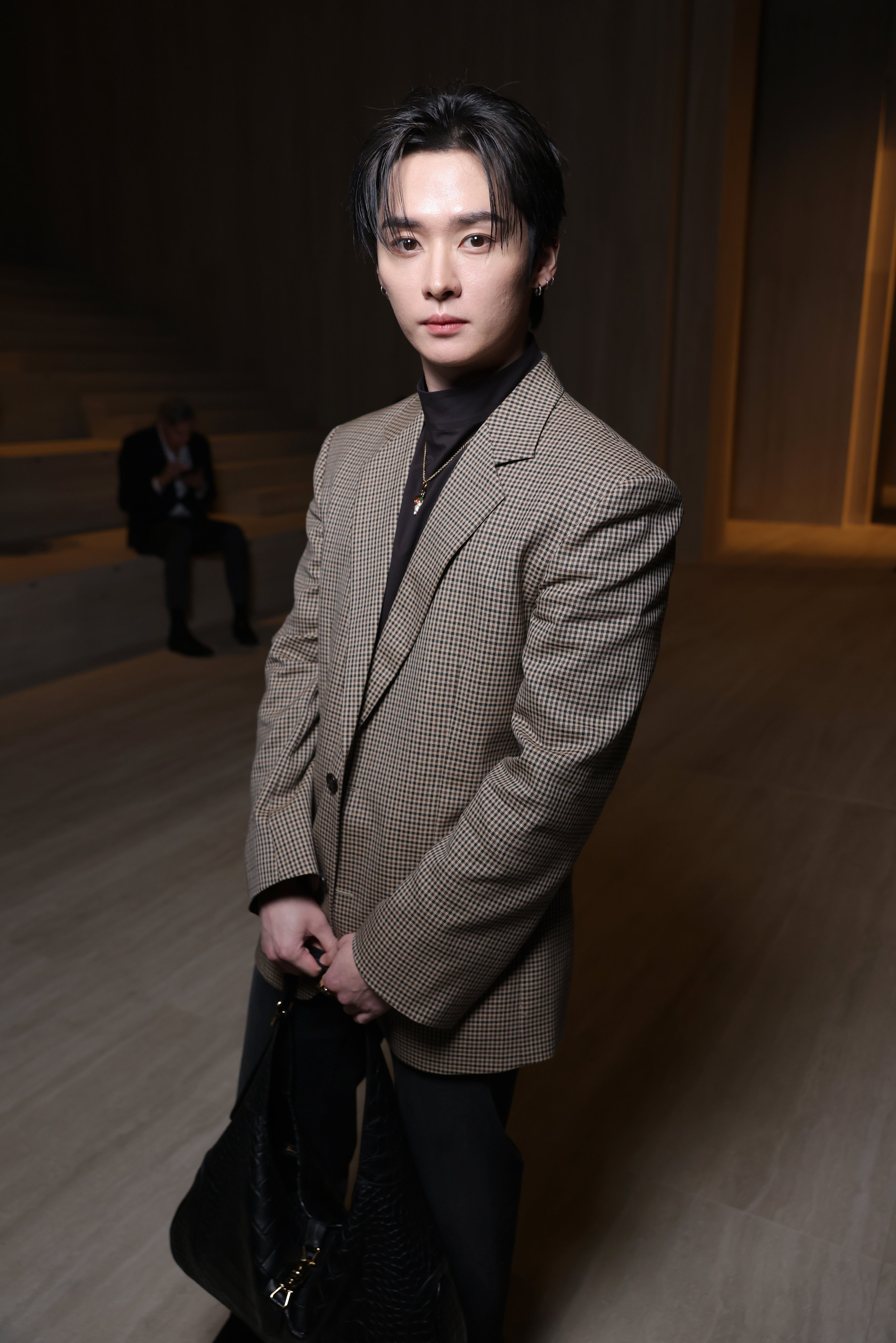 Lee Know at the Gucci Show in Milan in a tweed jacket