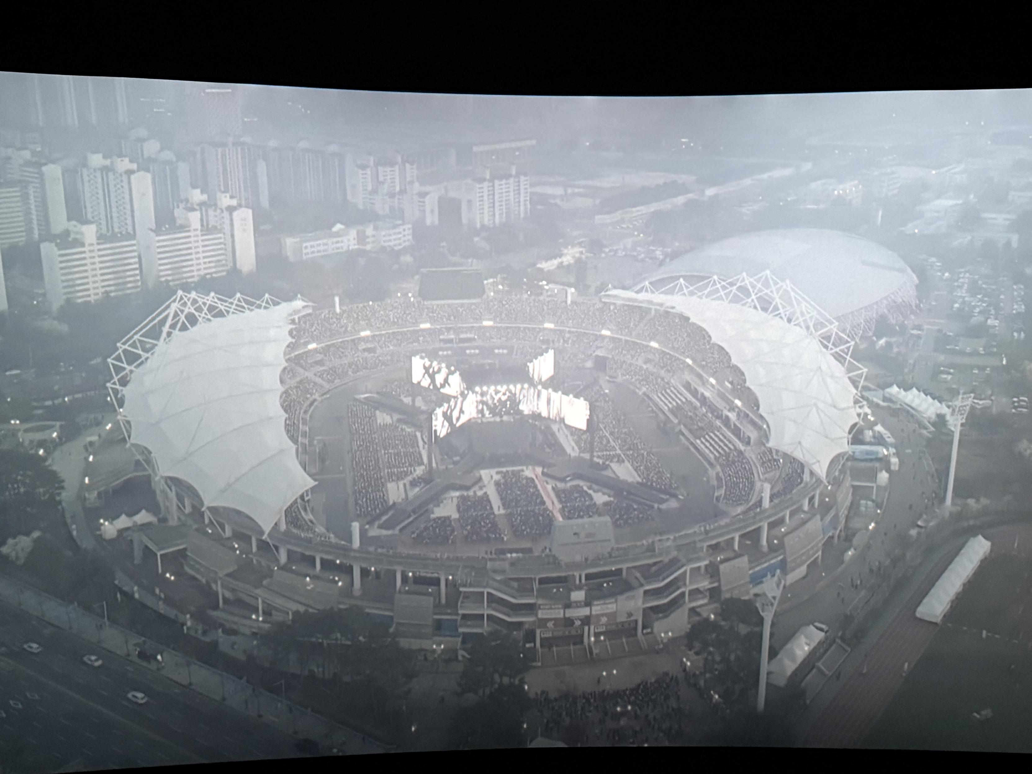 Picture of the screen in cinema. It shows a full view over the stadium In Goyang